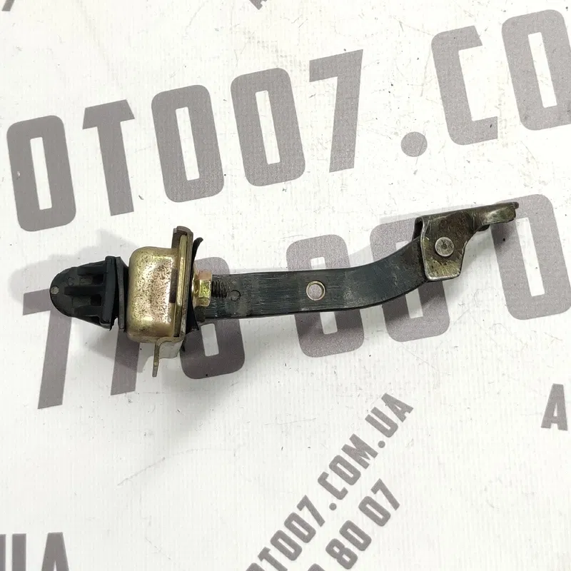 Обмежувач дверей Mazda Premacy (99-05) 1.8 бенз передня ліва