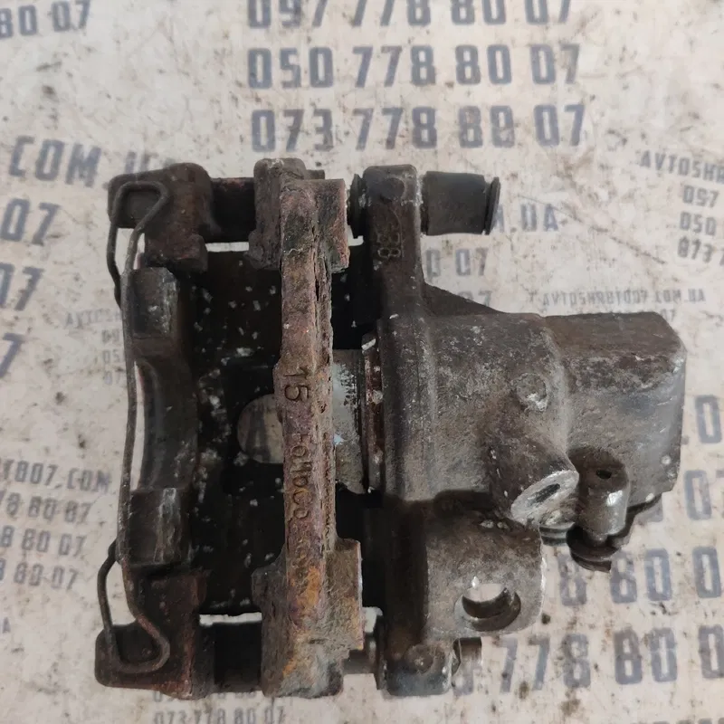 Тормозний супорт Mazda 3 BK (03-09) зад. лівий OEM 15F0M000