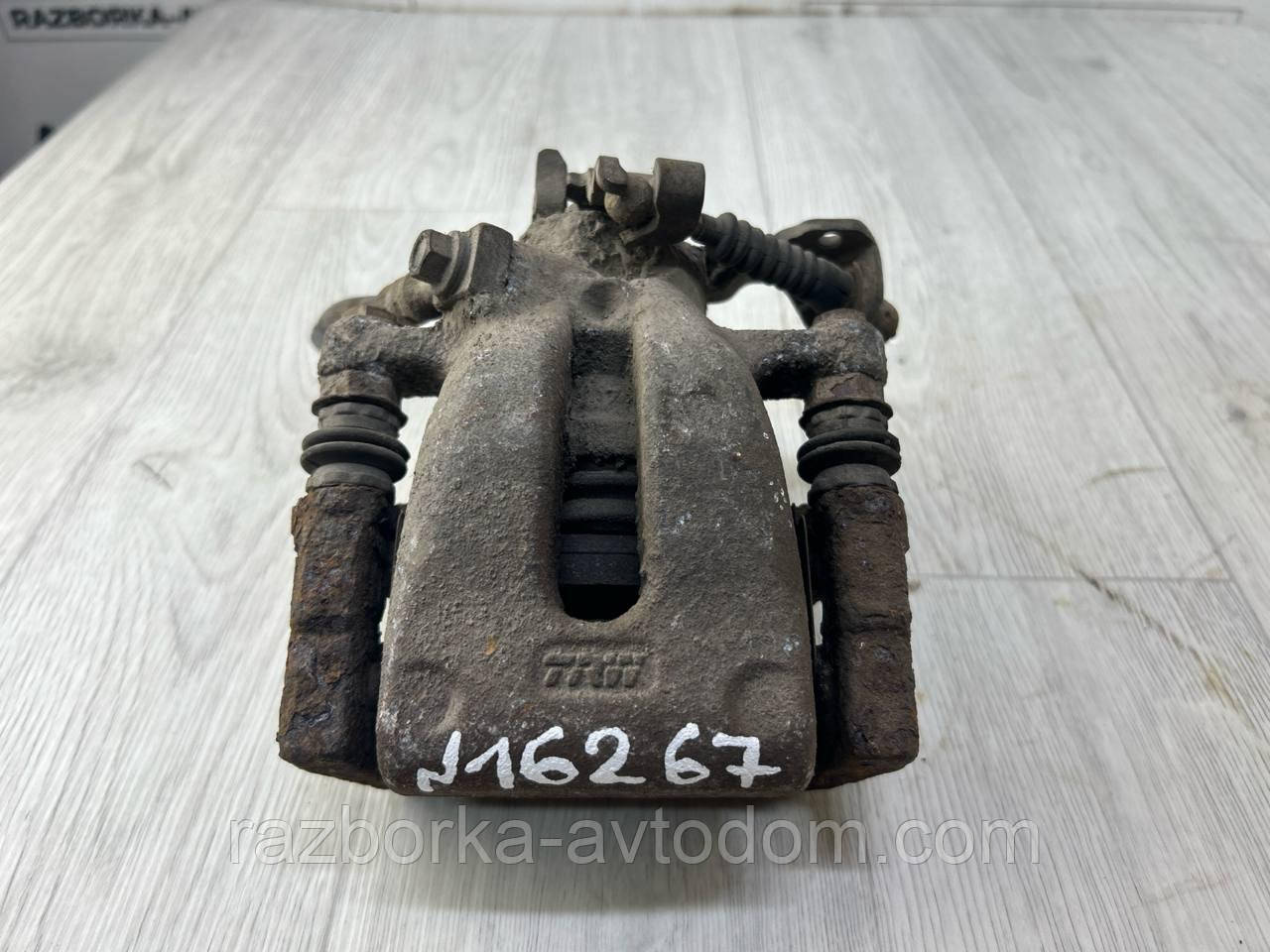 Суппорт гальмівний задній лівий Opel Zafira B (05-10) OE:95520049