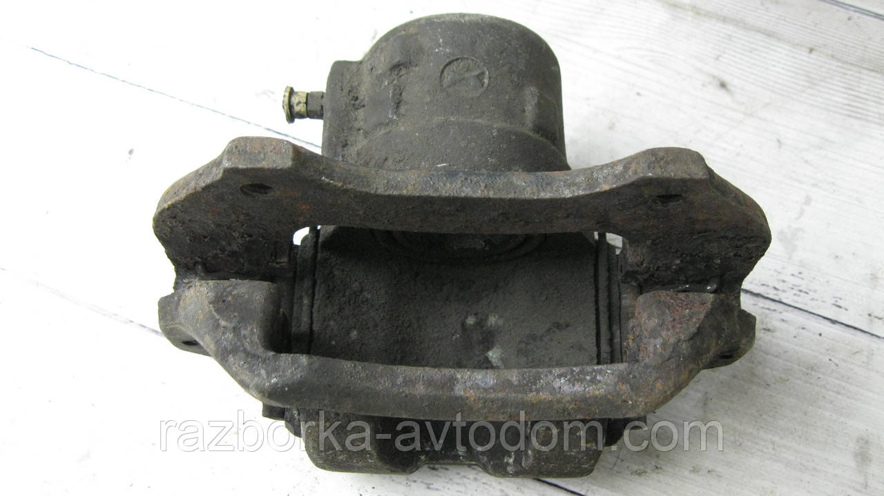 Суппорт передній лівий Fiat Uno, Panda, 131, Lancia Y10 OE:99552577
